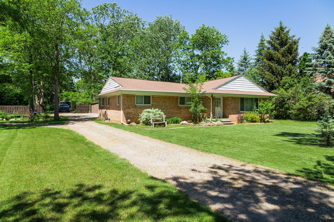 And SPACIOUS Brick Ranch With A LARGE Garage And In